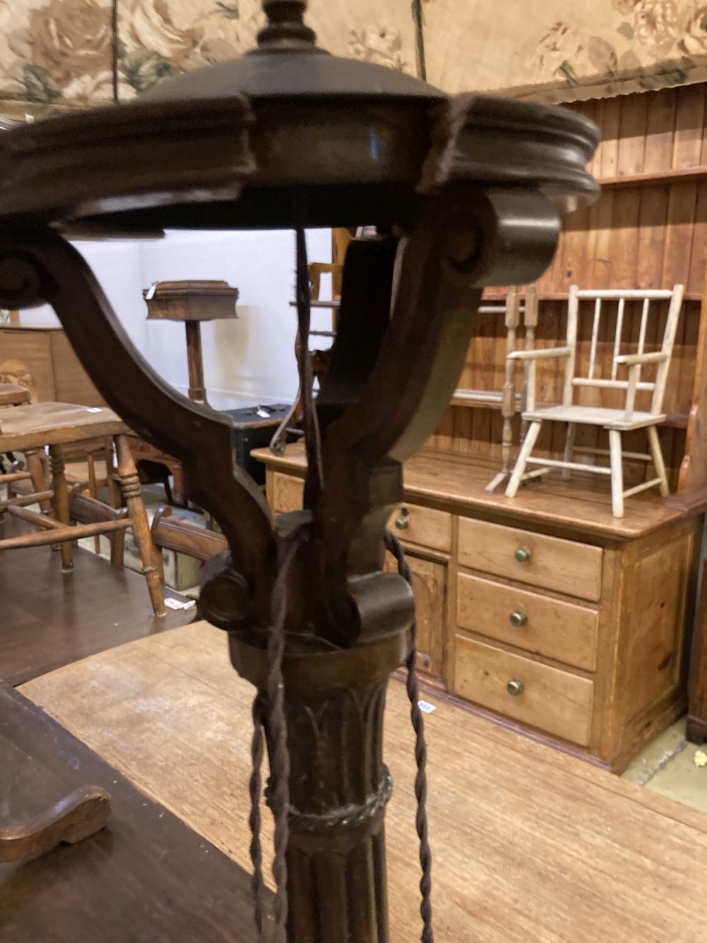 A Victorian mahogany tripod wine table, diameter 50cm height 70cm, together with a carved standard lamp